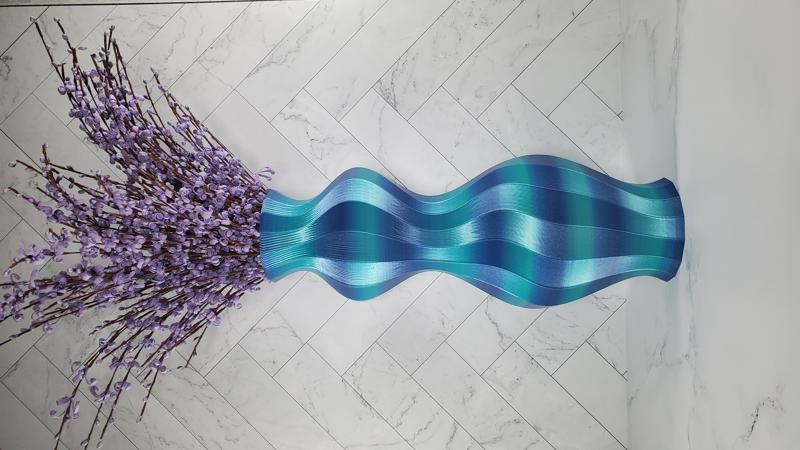 Blue hourglass vase with flowers