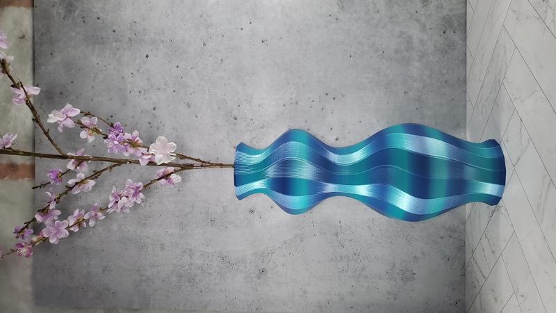 Blue hourglass vase with cherry blossoms
