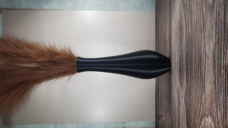 Black tall fluted vase with pampas grass