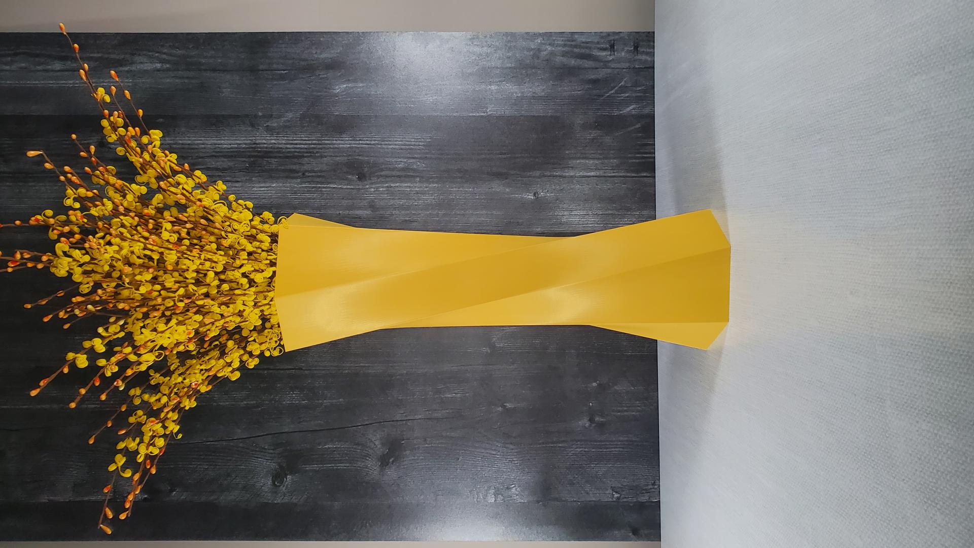 Tall geometric yellow vase with flowers